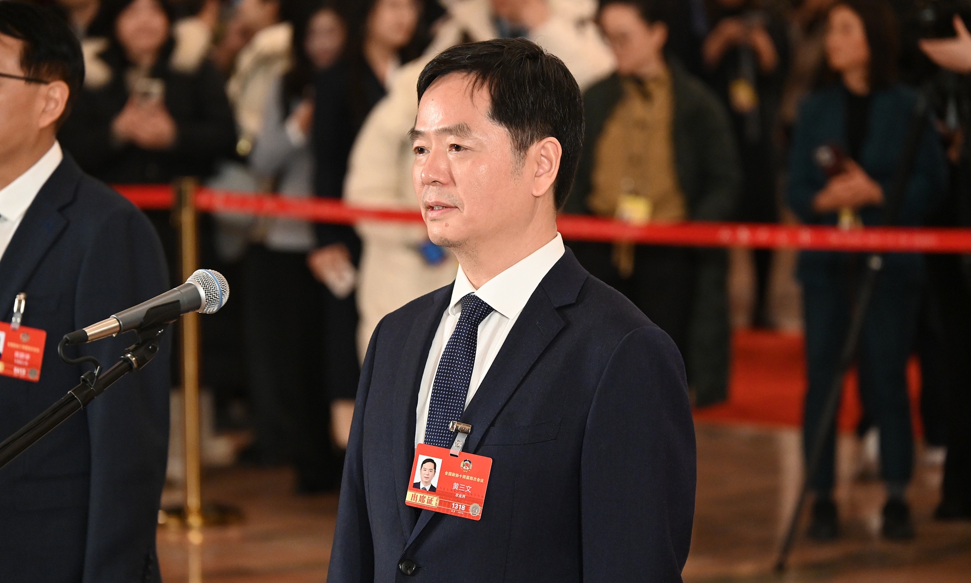 Huang Sanwen, a member of the 14th National Committee of the Chinese People's Political Consultative Conference (CPPCC), an academician of the Chinese Academy of Sciences, as well as President of the Chinese Academy of Agricultural Sciences speaks during a question-and-answer session at the Members' Corridor group interview of the fourth session of the 14th National Committee of the CPPCC held at the Great Hall of the People in Beijing on March, 4, 2026. Photo: VCG