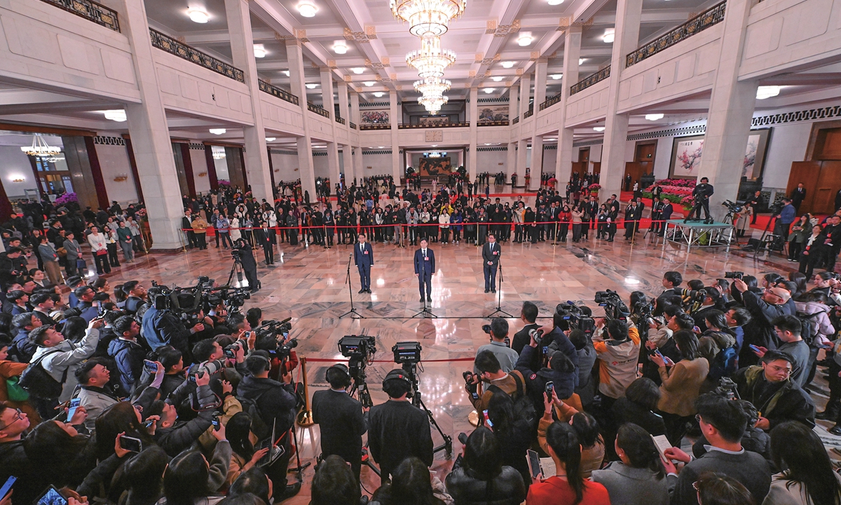 Members of the 14th National Committee of the Chinese People's Political Consultative Conference (CPPCC) speak to domestic and foreign journalists during a question-and-answer session at the Members' Corridor group interview of the fourth session of the 14th National Committee of the CPPCC held at the Great Hall of the People in Beijing on March 4, 2026. Photo: VCG