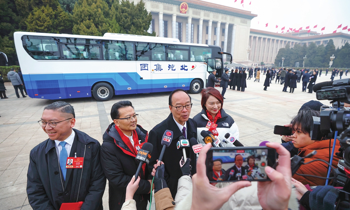 Deputies from the Hong Kong Special Administrative Region to the National People's Congress (NPC) give media interviews before the preparatory meeting of the fourth session of the 14th NPC held on March 4, 2026. Photo: VCG