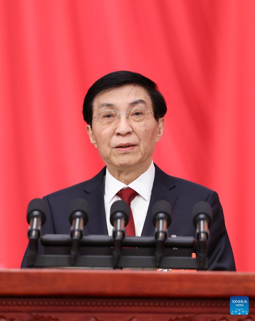 Wang Huning, chairman of the Chinese People's Political Consultative Conference (CPPCC) National Committee, delivers a work report on behalf of the Standing Committee of the CPPCC National Committee at the opening meeting of the fourth session of the 14th CPPCC National Committee at the Great Hall of the People in Beijing, capital of China, March 4, 2026. (Xinhua/Yao Dawei)