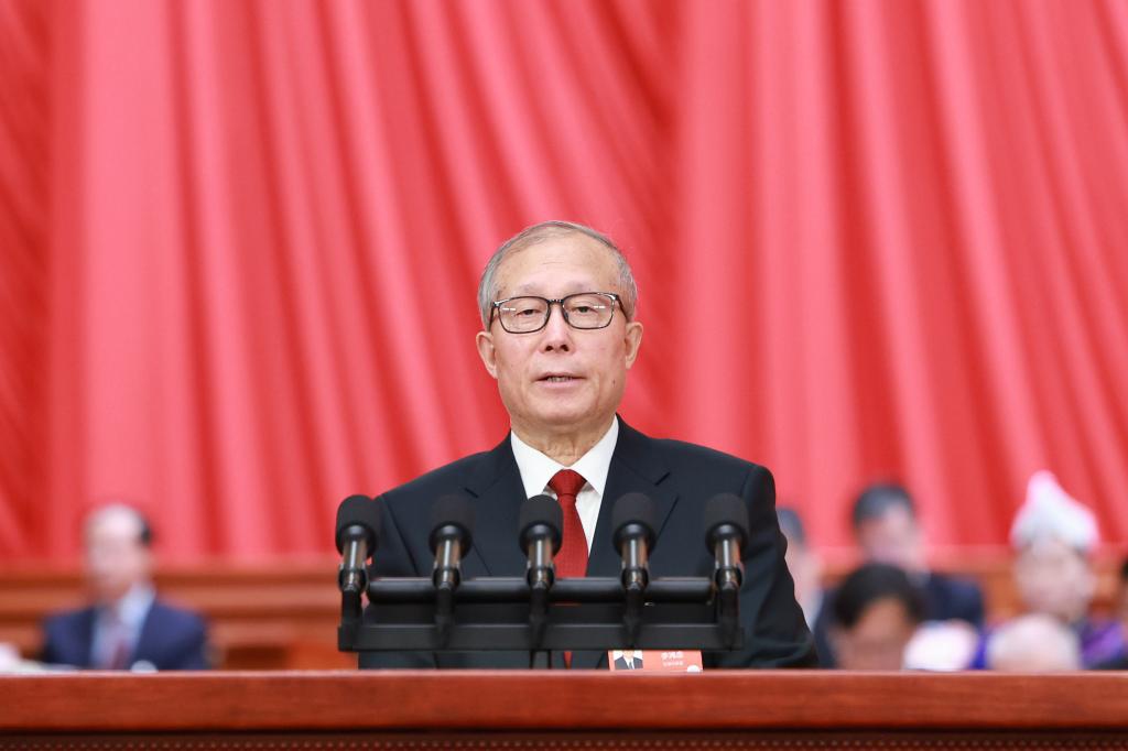 Li Hongzhong, vice chairman of the National People's Congress (NPC) Standing Committee, delivers explanatory remarks on a draft environmental code, a draft law on promoting ethnic unity and progress, and a draft law on national development planning at the opening meeting of the fourth session of the 14th National People's Congress (NPC) at the Great Hall of the People in Beijing, capital of China, March 5, 2026. (Xinhua/Ding Haitao)