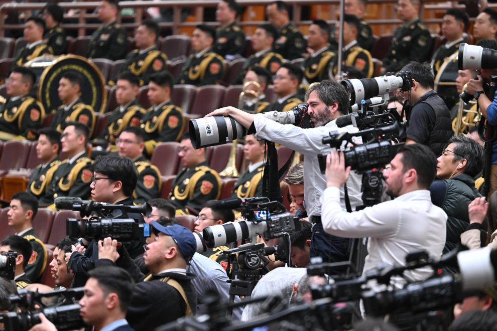 Journalists work at the opening meeting of the fourth session of the 14th National People's Congress (NPC) at the Great Hall of the People in Beijing, capital of China, March 5, 2026. (Xinhua/Li Xin)