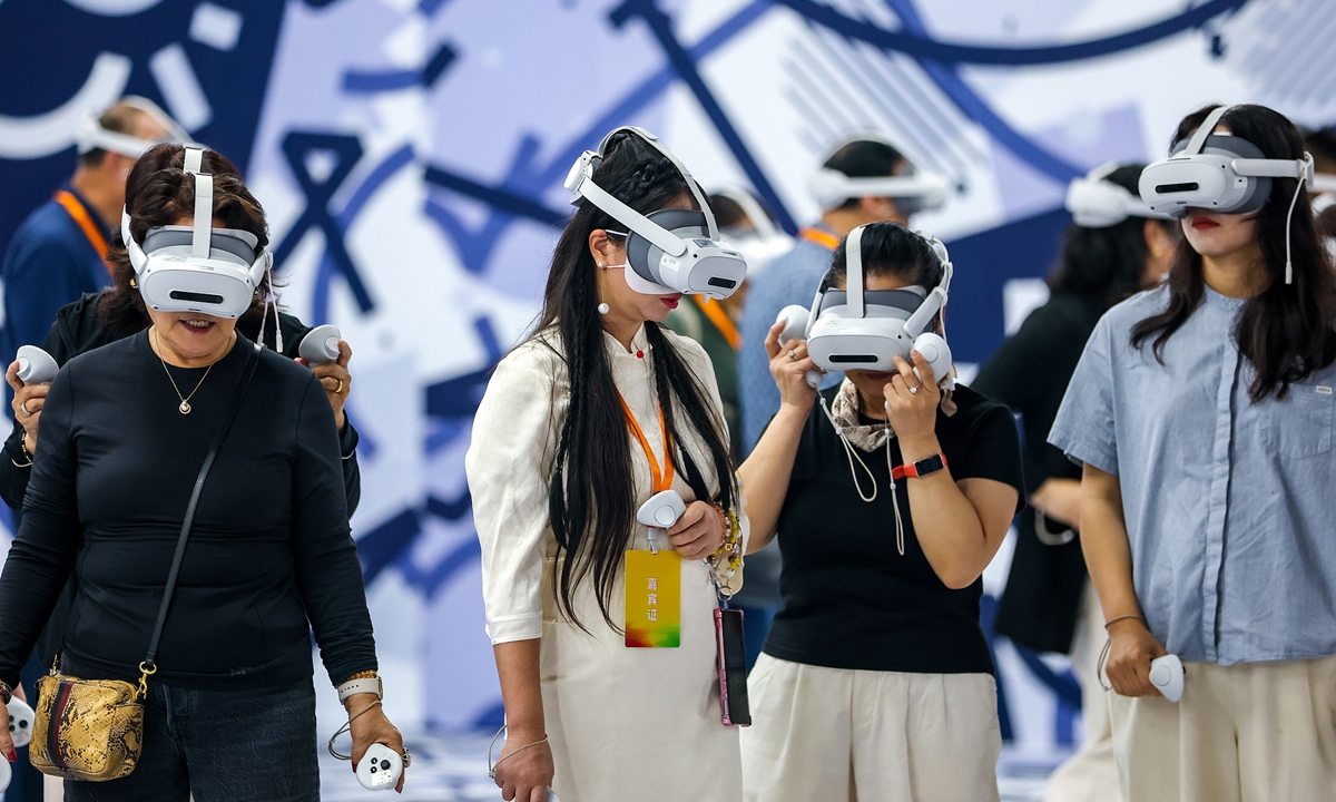 Media representatives from various countries experience VR glasses at a digital economy industrial park in Wuhan, Central China's Hubei Province, on September 24, 2025. Photo: VCG