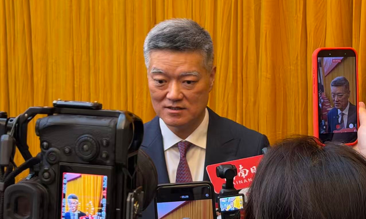Lawmaker Cai Qiang, who is also Secretary-General of South China's Hainan Provincial People's Government, speaks to the press after the open group meeting of the Hainan delegation to the fourth session of the 14th National People's Congress on March 7, 2026. Photo: Chen Qingqing/GT