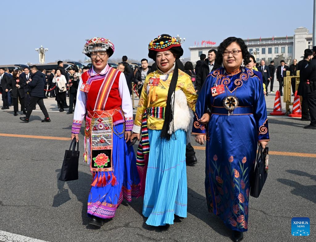 Members of the 14th National Committee of the Chinese People's Political Consultative Conference (CPPCC) walk towards the Great Hall of the People for the third plenary meeting of the fourth session of the 14th CPPCC National Committee in Beijing, capital of China, March 8, 2026. (Xinhua/Li He)