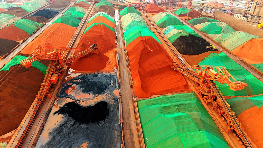 Heavy machinery is used to organize and transport imported iron ore at a terminal in the port of Qingdao, East China's Shandong Province on March 11, 2026. China's iron ore imports in the first two months of 2026 climbed 10 percent year-on-year, customs data showed. Photo: VCG