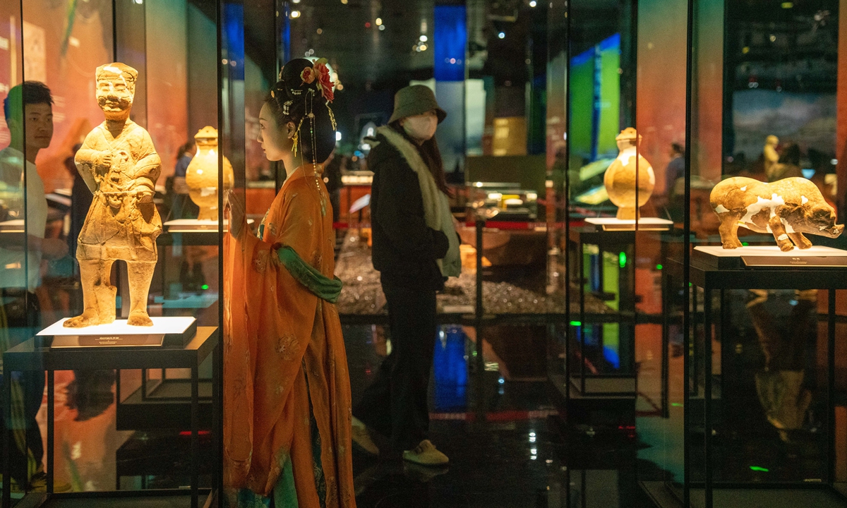 Tourists view relics at the Jiangkou Chenyin Museum in Meishan, Southwest China's Sichuan Province, on March 10, 2026. The museum's name, Jiangkou Chenyin, refers to 