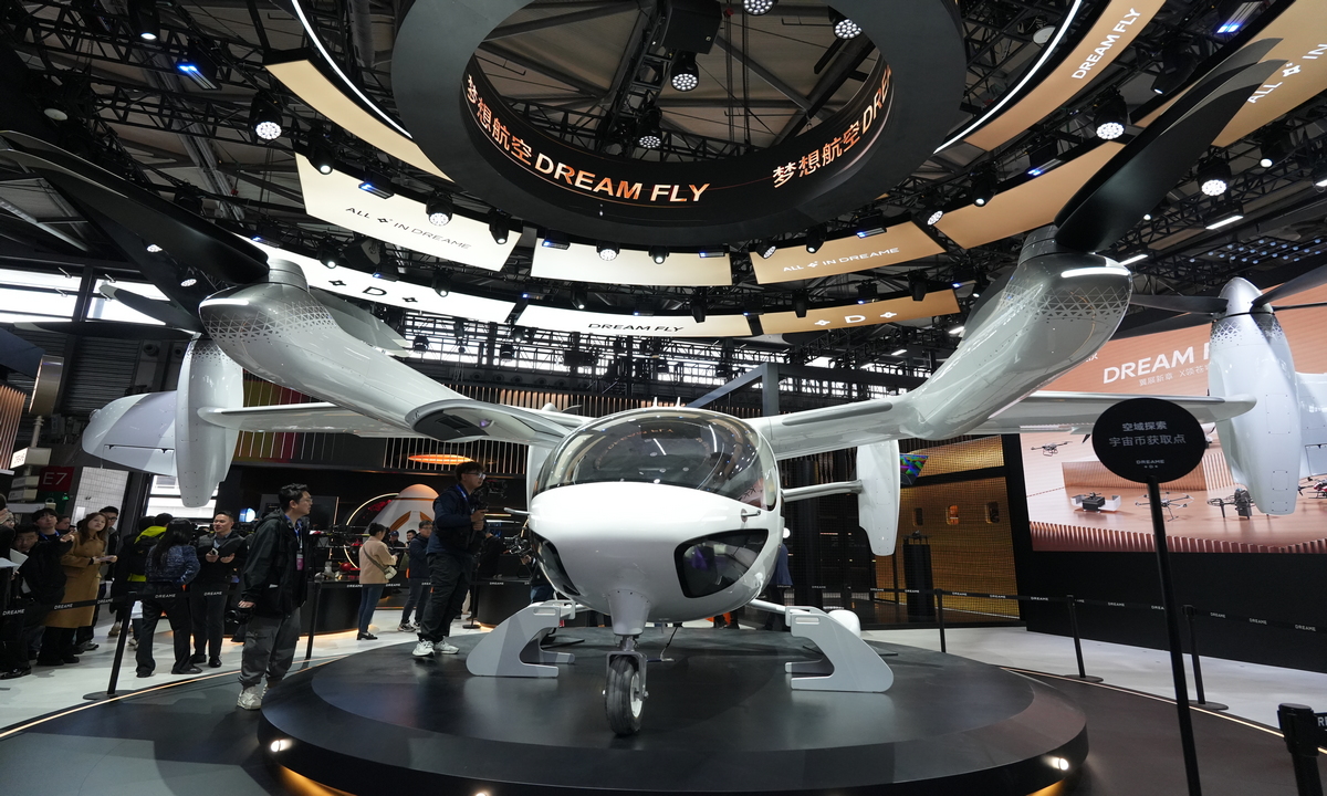 A futuristic electric vertical takeoff and landing aircraft developed by Dreamfly Technology Co makes its debut at the Appliance & Electronics World Expo 2026 in Shanghai, on March 12, 2026. The event runs from March 12 to 15, featuring 1,200 enterprises across 170,000 square meters, at the Shanghai New International Expo Center and the Eastern Hub business zone. Photo: VCG