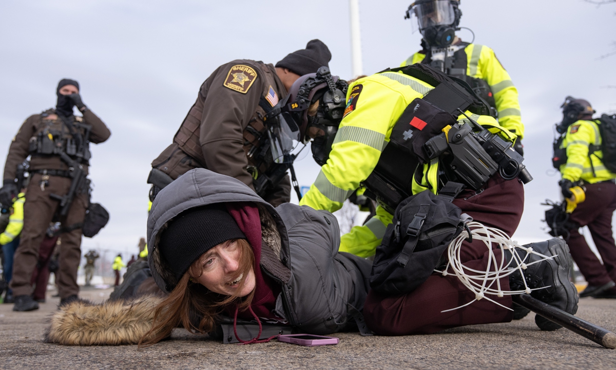 Patrol officers arrest an individual after an assembly in Minneapolis, Minnesota, the US, on February 7, 2026. Photo: VCG