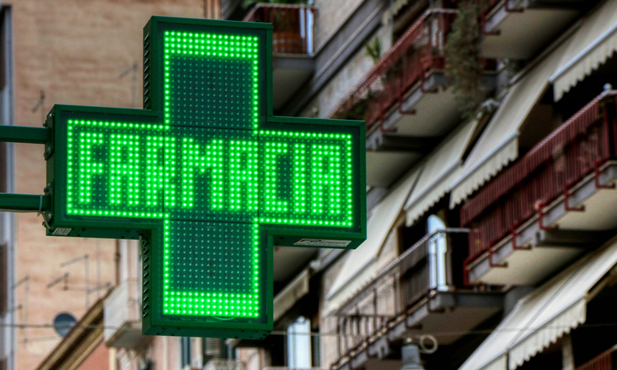 Drugstore sign in Italy  Photo: Courtesy of Milano Finanza
