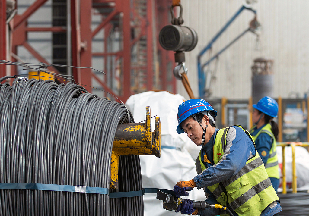 Employees work on a steel production line in Ma'anshan, East China's Anhui Province, on March 19, 2026, as factories ramp up production of auto parts. China's value-added industrial output went up 6.3 percent year-on-year in the first two months of 2026, official data showed. Photo： VCG