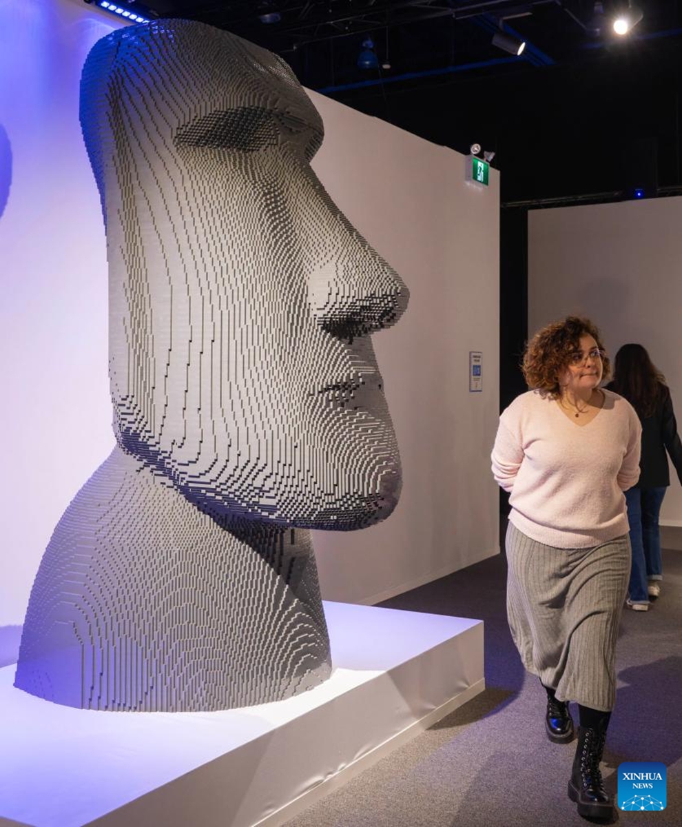 A woman walks past an artwork on display during the exhibition Art of the Brick in Toronto, Canada, on March 12, 2026. Showcasing over 130 artworks and constructions made out of more than one million LEGO bricks, this art exhibition is held here from March 5 to May 31. Photo: Xinhua