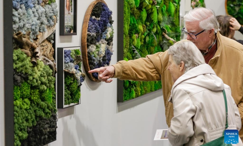 Visitors view moss wall art displayed during the 2026 BC Home and Garden Show in Vancouver, British Columbia, Canada, on March 12, 2026. The four-day event runs through March 15. Photo: Xinhua
