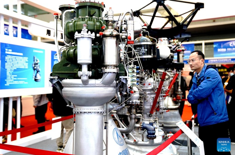 A man views a rocket engine during the 2026 Shanghai Commercial Aerospace Conference & Exhibition at Shanghai New International Expo Center in Shanghai, east China, March 12, 2026. This event, also the founding session, kicked off here on Thursday and will last till March 14. Photo: Xinhua