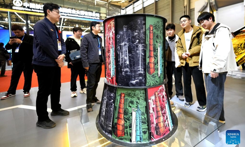 People view a satellite load-bearing tube during the 2026 Shanghai Commercial Aerospace Conference & Exhibition at Shanghai New International Expo Center in Shanghai, east China, March 12, 2026. This event, also the founding session, kicked off here on Thursday and will last till March 14. Photo: Xinhua