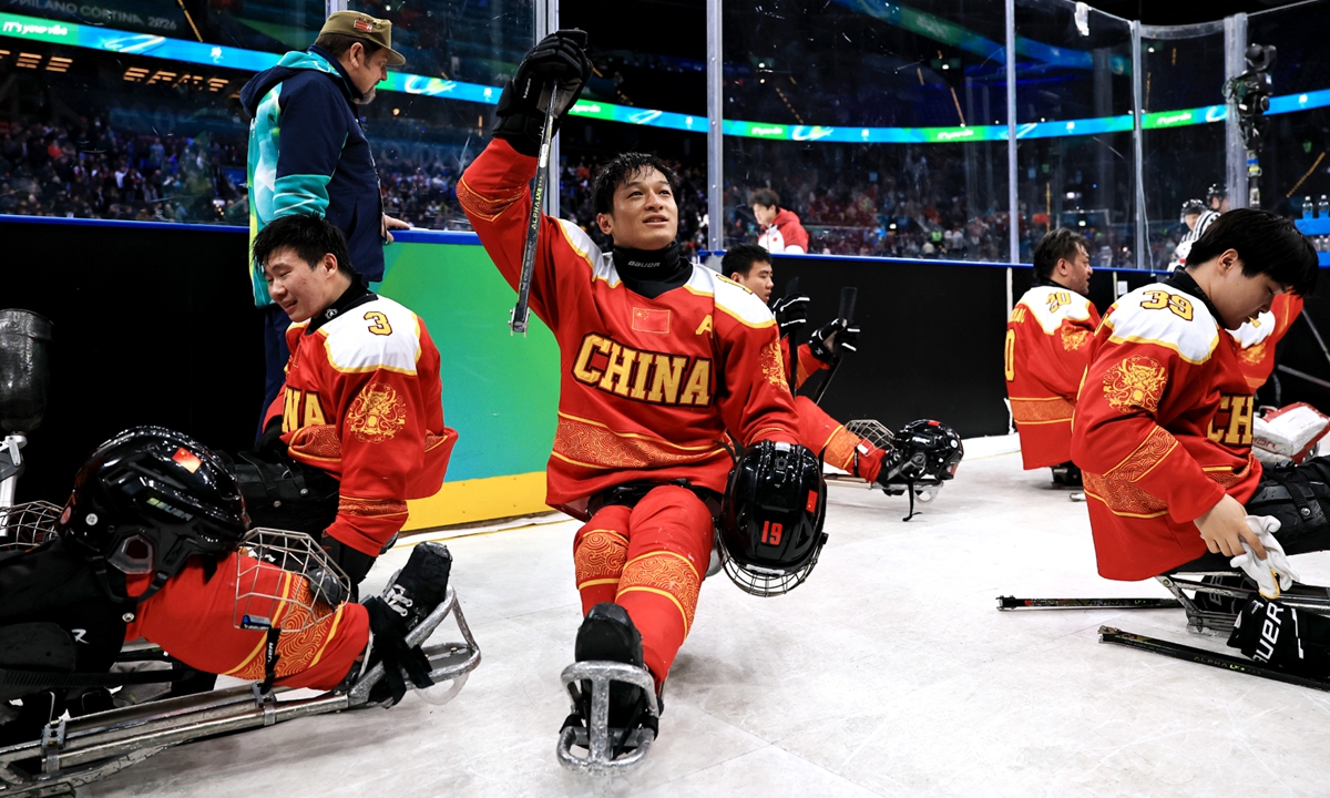 Shen Yifeng of China celebrates following the team's victory during the Para Ice Hockey Open Team Tournament Bronze Medal Match between China and the Czech Republic at the Milano Cortina 2026 Winter Paralympic Games at Milano Santagiulia Ice Hockey Arena on March 15, 2026 in Milan, Italy. Photo: VCG
