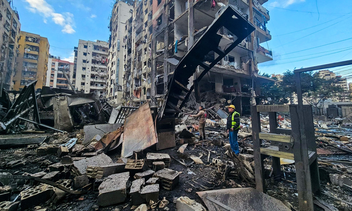 Local residents inspect the site of an overnight Israeli airstrike in Beirut, Lebanon on March 16, 2026. The Israeli military stated on the day that it had launched what it called a limited ground operation against Hezbollah in southern Lebanon. Photo: VCG