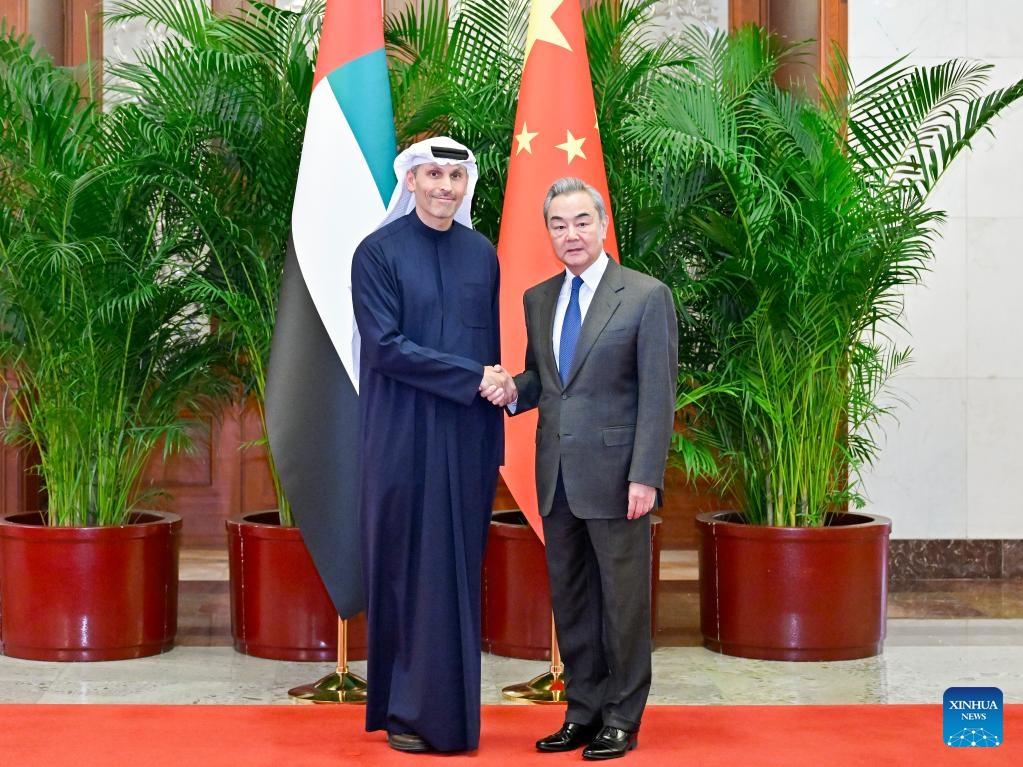 Wang Yi, a member of the Political Bureau of the Communist Party of China Central Committee and director of the Office of the Central Commission for Foreign Affairs, holds talks with Khaldoon Khalifa Al Mubarak, special envoy of the president of the United Arab Emirates (UAE) to China, in Beijing, capital of China, March 18, 2026. (Xinhua/Yue Yuewei)