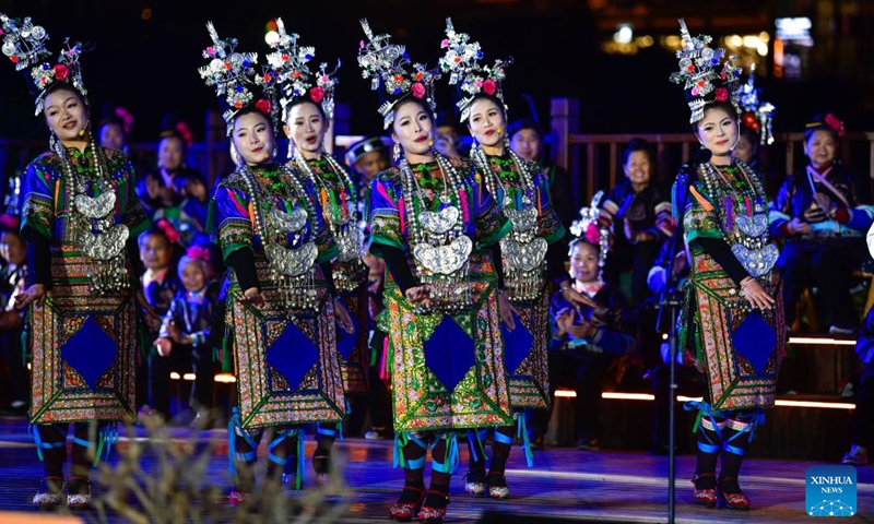 Members of a local choir sing a grand song of the Dong ethnic group at Zhaoxing Dong Village of Liping County, southwest China's Guizhou Province, March 23, 2026. The Whiffenpoofs a cappella choir of Yale University visited Liping County in southwest China's Guizhou Province from March 23 to 24 for cultural exchange activities. (Xinhua/Yang Wenbin)

