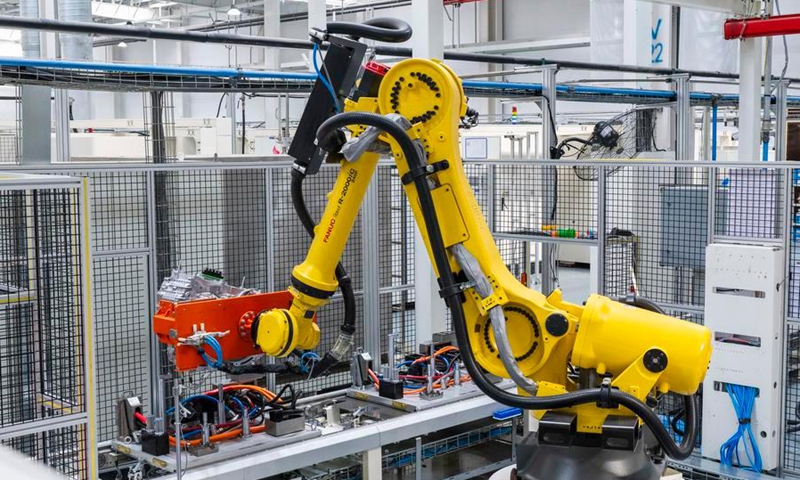 An industrial robot works on an intelligent production line of Wuhu Ecotec Power System Co., Ltd. in Fanchang economic development zone of Wuhu, east China's Anhui Province, Nov. 11, 2025. (Photo by Xiao Benxiang/Xinhua)
