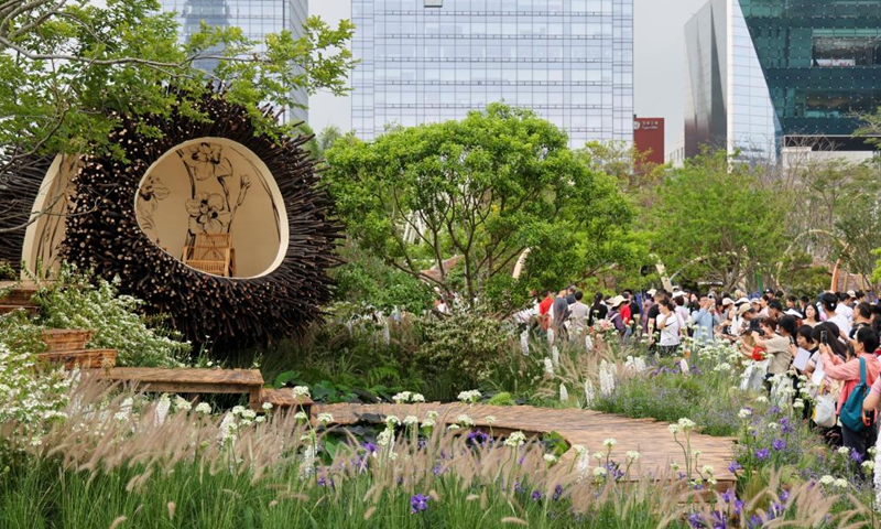 People visit a flower show in Shenzhen, south China's Guangdong Province, on March 27, 2026. The 2026 Guangdong-Hong Kong-Macao Greater Bay Area (GBA) Flower Show kicked off on Friday at Bijiashan Sports Park in Shenzhen, and will run until April 6. (Xinhua/Liang Xu)