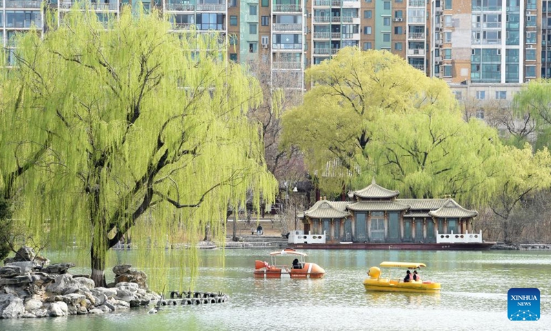 Tourists enjoy the scenery during a boat ride at Longtan Park in Dongcheng District in Beijing, capital of China, on March 27, 2026. (Xinhua/Luo Xiaoguang)

