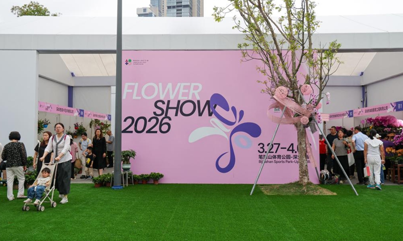 People visit a flower show in Shenzhen, south China's Guangdong Province, on March 27, 2026. The 2026 Guangdong-Hong Kong-Macao Greater Bay Area (GBA) Flower Show kicked off on Friday at Bijiashan Sports Park in Shenzhen, and will run until April 6. (Xinhua/Liang Xu)