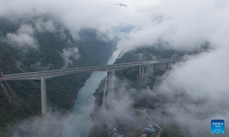 An aerial drone photo taken on March 26, 2026 shows a view of Wulong District shrouded in mist and clouds, southwest China's Chongqing. (Xinhua/Chen Cheng)

