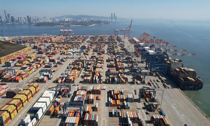 An aerial drone photo taken on Jan. 14, 2026 shows cargo ships loading and unloading containers at a container terminal in Xiamen, southeast China's Fujian Province. (Photo by Zeng Demeng/Xinhua)
