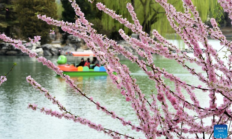 Tourists enjoy the scenery during a boat ride at Longtan Park in Dongcheng District in Beijing, capital of China, on March 27, 2026. (Xinhua/Luo Xiaoguang)

