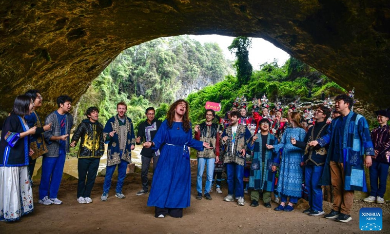Members of the Whiffenpoofs a cappella choir of Yale University sing a song at a scenic area in Liping County, southwest China's Guizhou Province, March 24, 2026. The Whiffenpoofs a cappella choir of Yale University visited Liping County in southwest China's Guizhou Province from March 23 to 24 for cultural exchange activities. (Xinhua/Yang Wenbin)

