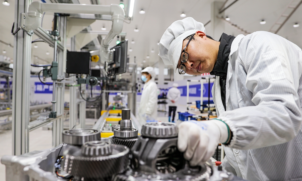 A worker fine-tunes automated production equipment for gearboxes inside a plant in Huaibei, East China's Anhui Province on March 18, 2026. The province aims to forge a modern industrial system featuring smart technology, green development and a high degree of integration, according to media reports. Photo: VCG