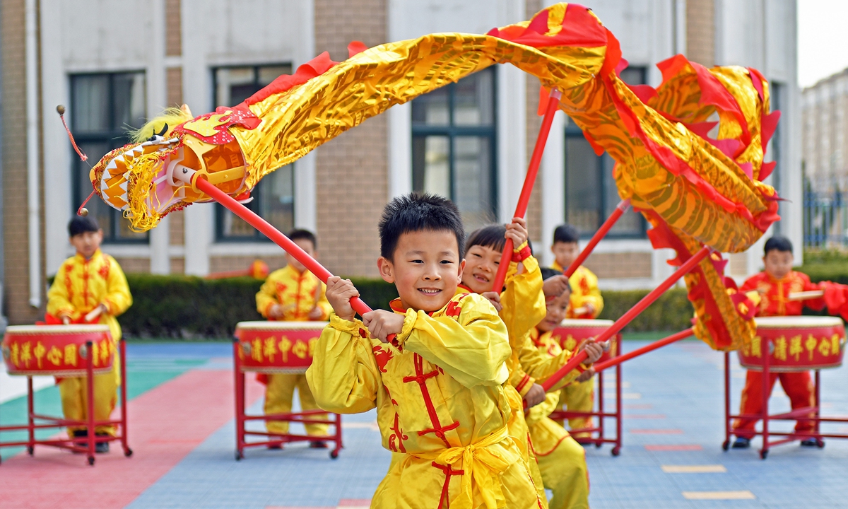 Children perform a dragon dance in Yantai, Shandong Province, on March 19, 2026, to celebrate the upcoming Longtaitou Festival, which falls on Friday this year. Longtaitou means 