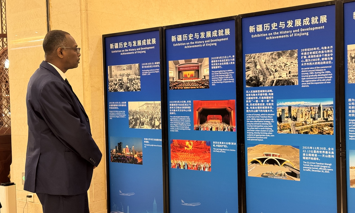 A foreign diplomat visits the Exhibition on the history and development achievements of Xinjiang on the sidelines of an exchange event held by Xinjiang authorities in Beijing on March 20, 2026. Photo: Li Yawei/GT
