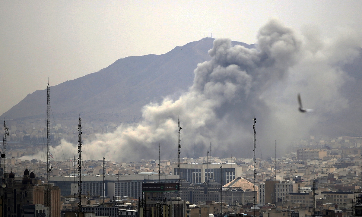 Smoke rises after airstrikes in Tehran, Iran, on March 13, 2026. Photo: VCG