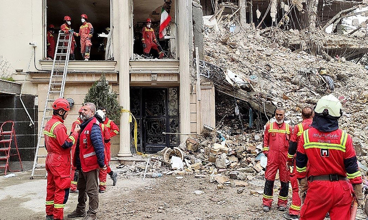 Rescue teams searching for survivors trapped after a bombing struck a damaged apartment building in northern Tehran, Iran, on March 23, 2026. The attack came amid the ongoing joint offensive by the US and Israel against Iran. Photo: VCG