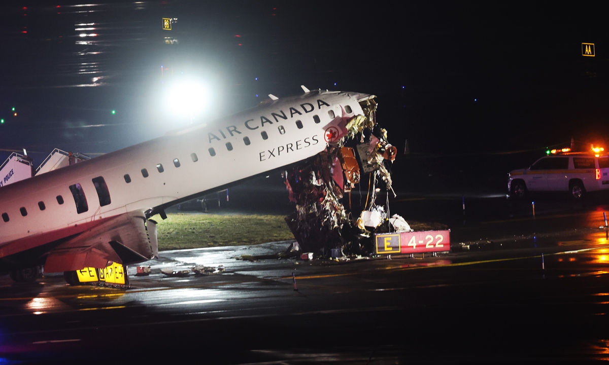 An Air Canada Express plane sits on the tarmac after it collided with a fire truck on the tarmac at LaGuardia Airport on March 23, 2026 in New York City, US. The plane had landed from a flight from Montreal. Photo: VCG