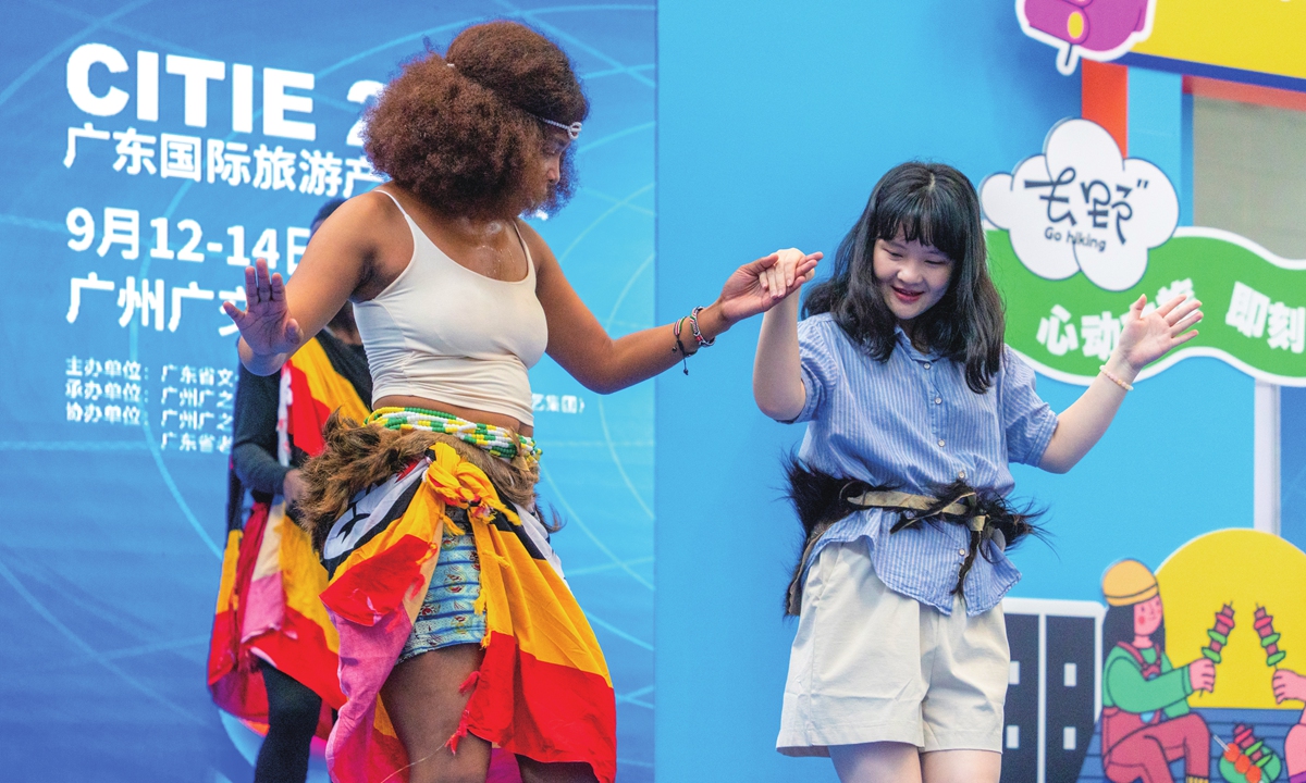Chinese tourists experience African tribal dances with Ugandan performers at the 2025 China (Guangdong) International Tourism Industry Expo in Guangzhou, South China's Guangdong Province, on September 13, 2025. Photo: VCG