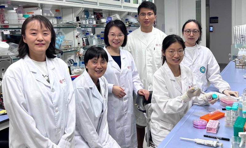 This photo taken on July 24, 2025 shows researchers posing for a group photo at the College of Future Technology, Peking University (PKU) in Beijing, capital of China.  (PKU/Handout via Xinhua)
