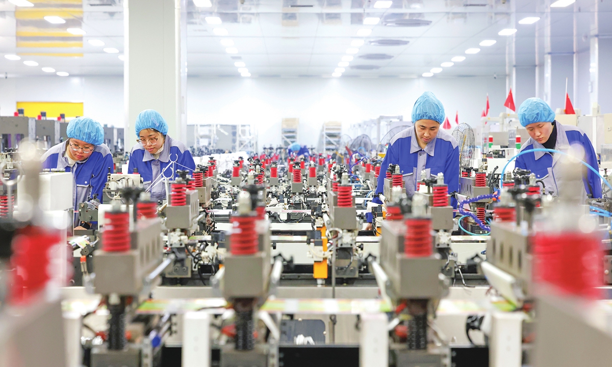 Workers produce plastic film for export orders at a factory in Sihong County, East China's Jiangsu Province, on March 24, 2026. In recent years, the region has promoted the clustering and upgrading of the new materials industry through technological empowerment, policy incentives and innovation-driven development. Photo: VCG