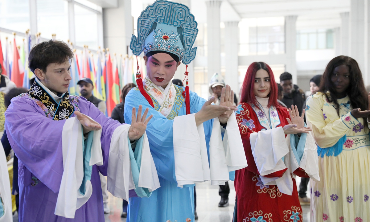 International students experience the local Yangju Opera in Zhenjiang, East China's Jiangsu Province on March 24, 2026. Yangju Opera performers came to the campus to teach international students basic performing skills of the opera, allowing them to experience the charm of Chinese culture in celebration of the upcoming World Theatre Day, which falls on March 27 each year. Photo: VCG