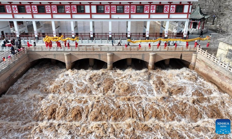 An aerial drone photo taken on March 24, 2026 shows an opened sluice gate diverting water from the Yellow River for irrigation in Qingtongxia, northwest China's Ningxia Hui Autonomous Region. (Xinhua/Wang Peng)

