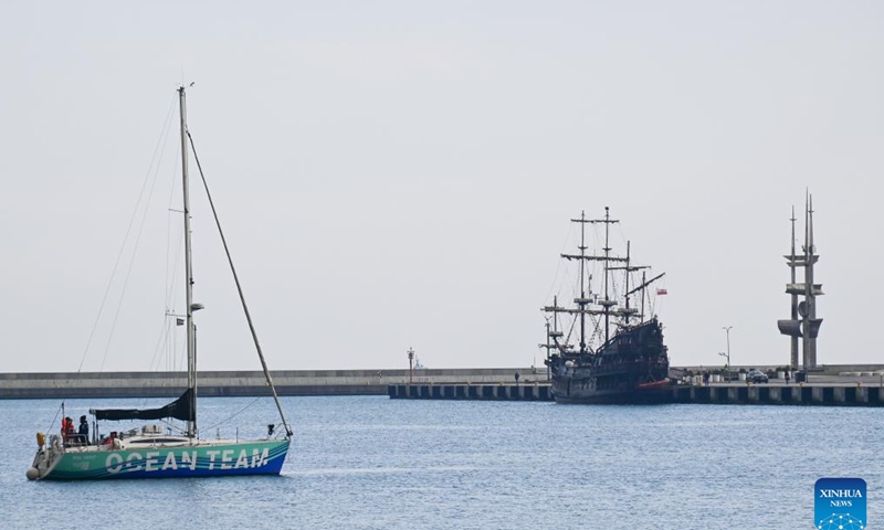 A boat sails near a harbor in a coastal village of Gdynia, Poland, on March 23, 2026. Gdynia, located on the Baltic coast, is an important port and seaside tourist city. Together with Gdansk and Sopot, it forms a large port city complex known as the Tricity. (Photo by Aleksy Witwicki/Xinhua)

