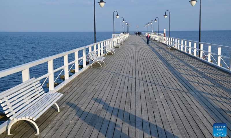 A wooden pier extends into the sea in a coastal village of Gdynia, Poland, on March 23, 2026. Gdynia, located on the Baltic coast, is an important port and seaside tourist city. Together with Gdansk and Sopot, it forms a large port city complex known as the Tricity. (Photo by Aleksy Witwicki/Xinhua)

