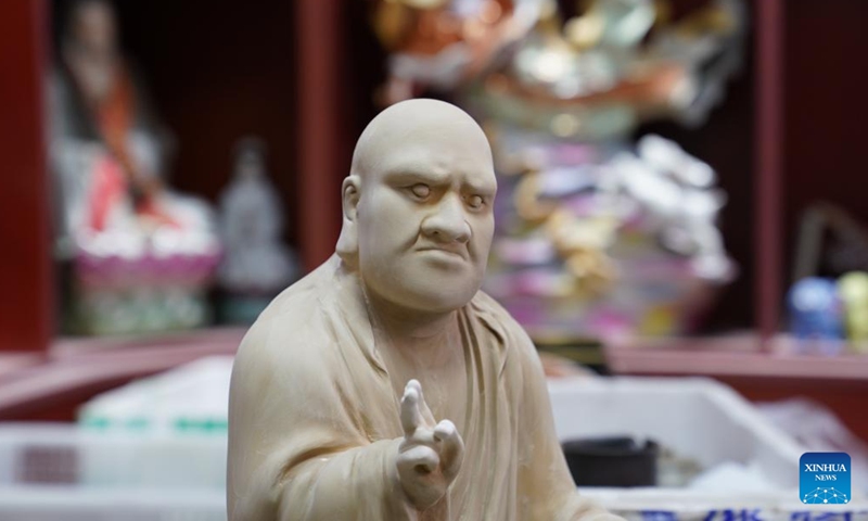 This photo taken on March 12, 2026 shows a porcelain sculpture made by Zeng Rui's studio in Jingdezhen, east China's Jiangxi Province.(Xinhua/Zhou Mi)

