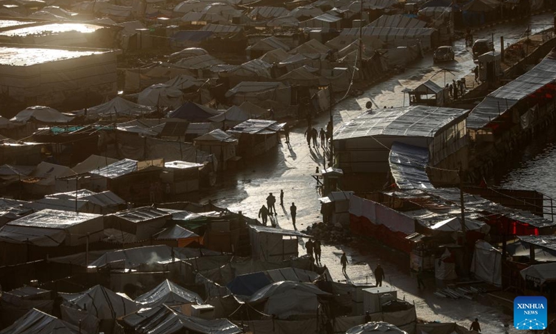 Photo taken on March 25, 2026, shows the temporary tents for displaced Palestinians, in west of Gaza City. (Photo by Rizek Abdeljawad/Xinhua)


