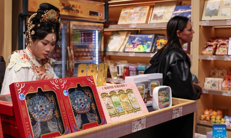 People visit a shop selling cultural and creative products at the Summer Palace in Beijing, capital of China, March 23, 2026. As temperature rises, multiple parks and scenic spots in Beijing have held spring-themed fairs and launched cultural and creative products, giving a nice boost to the spring economy. (Xinhua/Zhang Fan)


