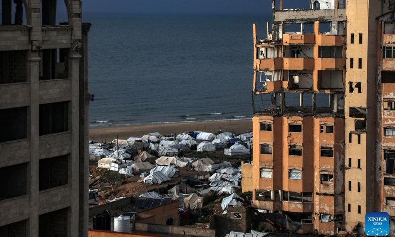 Photo taken on March 25, 2026, shows the temporary tents for displaced Palestinians, in west of Gaza City. (Photo by Rizek Abdeljawad/Xinhua)

