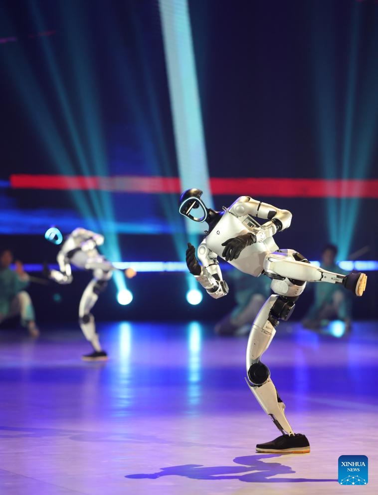 Humanoid robots perform during the opening ceremony of the 10th World Junior Wushu Championships in Tianjin, north China, March 25, 2026. (Xinhua/Sun Fanyue)

