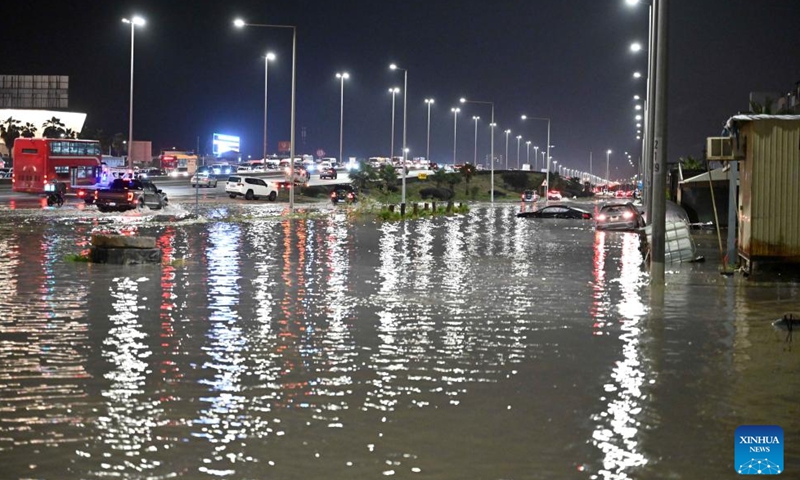 Cars are stranded and submerged in water after heavy rain in Mubarak Al-Kabeer Governorate, Kuwait, March 25, 2026. Heavy rainfall and unstable weather conditions affected several parts of Kuwait on Wednesday. (Photo by Asad/Xinhua)

